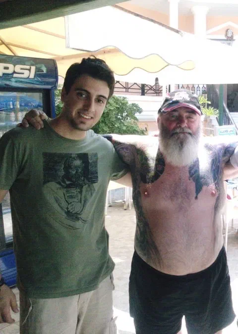 Panos behind a bar in Zakynthos, Greece